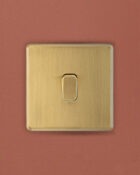 Gold Arlec Fusion single switch on wall