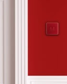 Arlec Fusion Cherry Red double light switch on wall