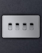 Polished chrome Arlec Fusion 4gang switch on wall