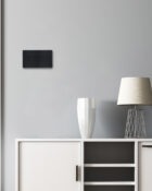 Jet Black Arlec Rocker 4g light switch on wall