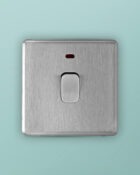 Stainless steel Arlec Fusion 20A double pole switch on wall