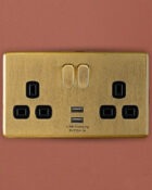 Gold Arlec Fusion double socket on wall